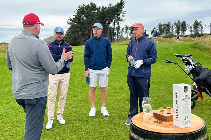 Getting ready to tee off at Dumbarnie Golf Links and having a wee drab of Loch Lomond Whisky