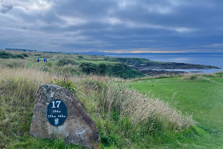 The signature hole at the Castle Course, Hole 17 over the rugged coastline and overlooking St Andrews town