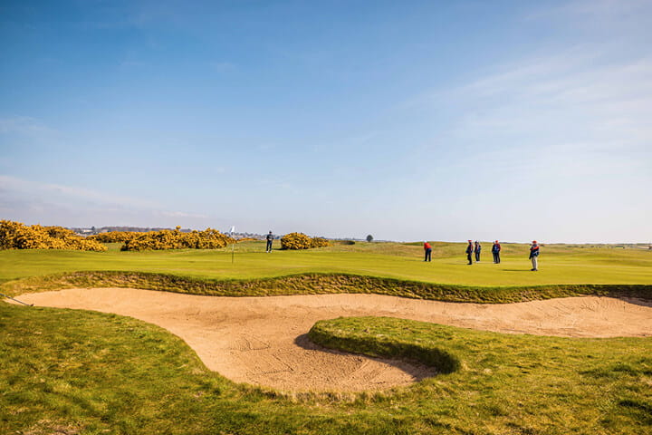 Bunker and hole at Carnoustie Golf Links Course in Scotland