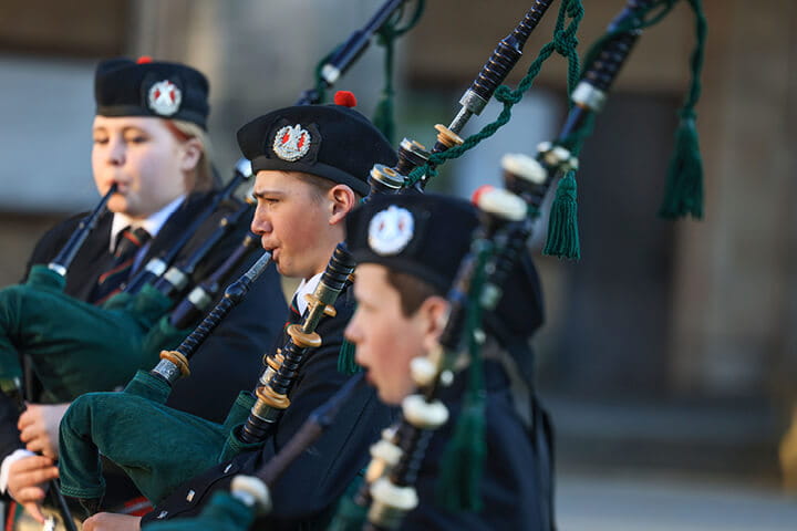 The history of whisky and tartan with traditional scottish bag pipes