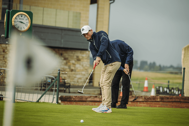 The Experience Golf Guest practising his putting ahead of teeing off at Carnoustie Golf Links in St Andrews, Scotland