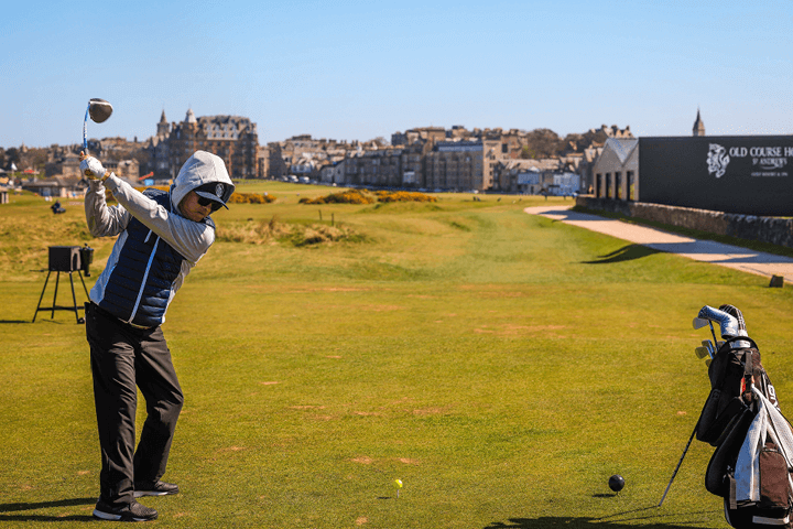 The Experience Golf guest teeing off at hole 17 on the Old Course in St Andrews