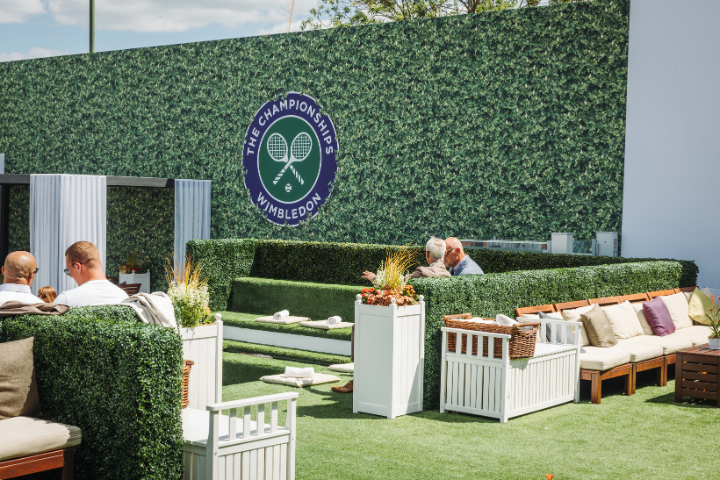 Guests enjoying the garden in the Lawn hospitality facility at Wimbledon.