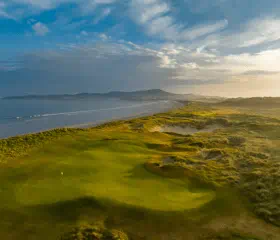 Rosapenna St Patricks Links at sunrise over the sea.