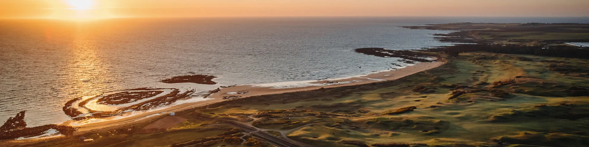 Scotland Coastline and Golf Course at sunset.