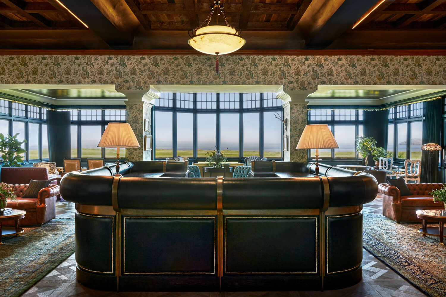 Lounge area with seating and views of the golf course at the Marine North Berwick Boutique Hotel in Scotland