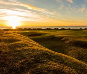 Beautiful sunset over the Brora golf course in Scotland