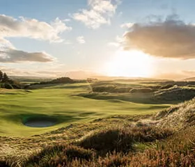 The sun setting over the Castle Stuart golf course in Scotland