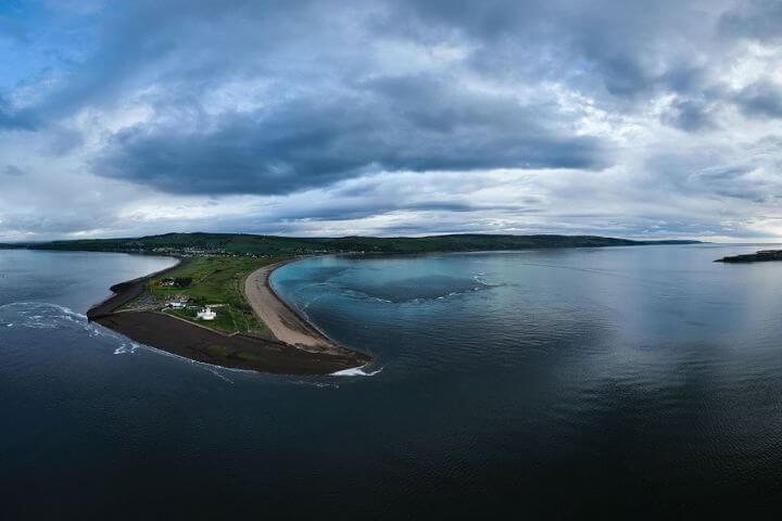 Panoramic view of the Fortrose and Rosemarkie golf course in Scotland from the sea