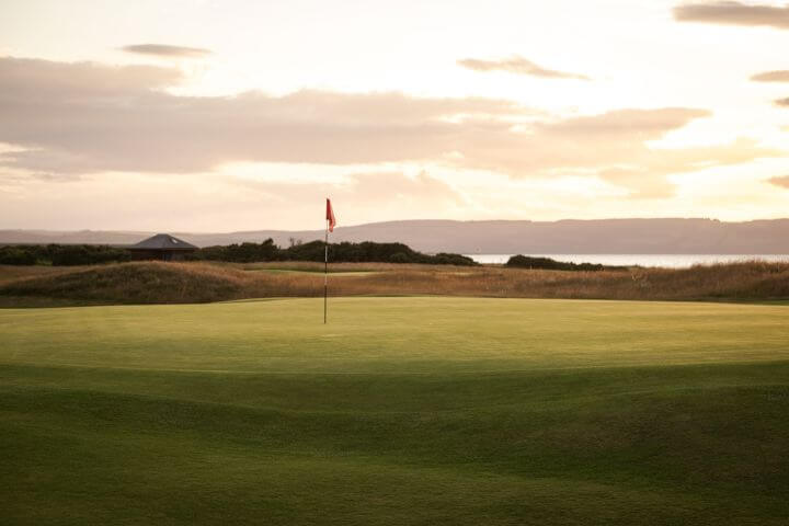 View of the green at sunrise at the Nairn golf course in Scotland