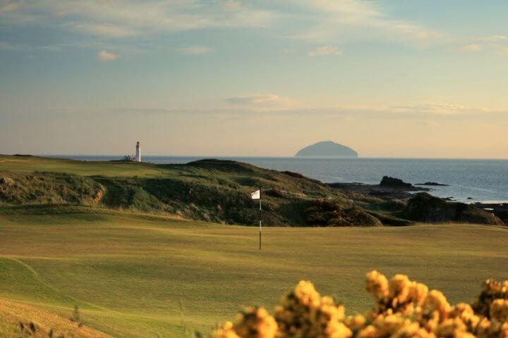 View of the island in the distance from the King Robert the Bruce golf course in Scotland
