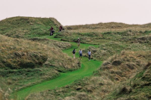 Golfers on Waterville Golf Course in South West Ireland.
