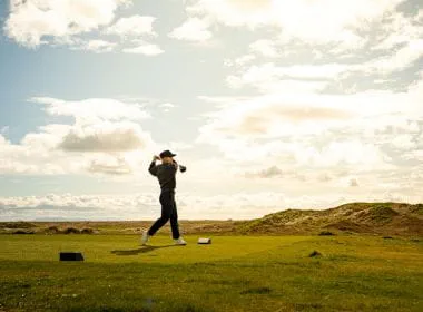 Emma O'Driscoll teeing off on Dumbarnie Links, St Andrews.