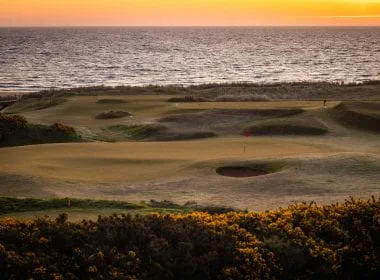 St Andrews sunset and sea with golf course.