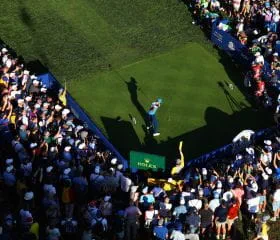 Golfer teeing off at 2025 Ryder Cup, Bethpage.